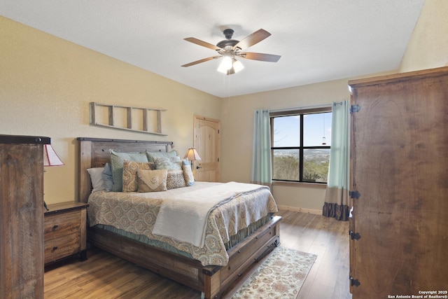 bedroom featuring hardwood / wood-style floors and ceiling fan