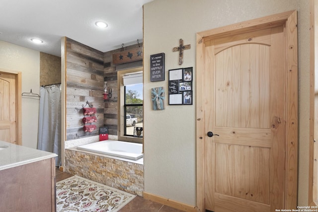 bathroom with shower with separate bathtub