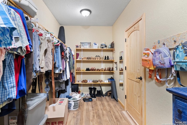 walk in closet featuring light wood-type flooring