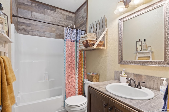 full bathroom featuring vanity, toilet, and shower / tub combo