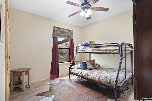 bedroom featuring ceiling fan and light wood-type flooring