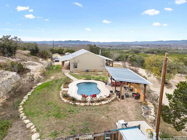 view of swimming pool featuring a mountain view