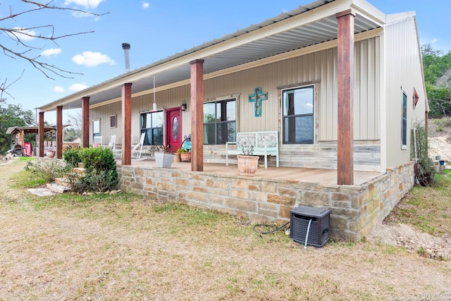 back of house with a porch