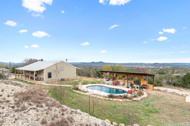 view of swimming pool featuring a mountain view