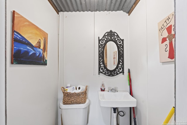 bathroom featuring sink and toilet