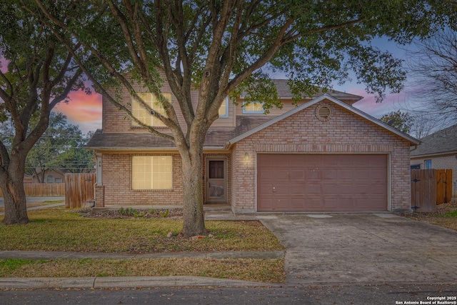 view of front of house with a garage and a lawn