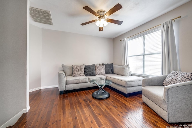 living room featuring dark hardwood / wood-style floors and ceiling fan