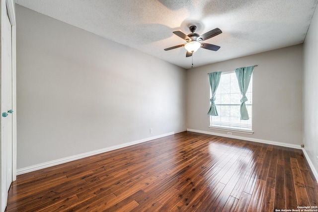 unfurnished room with ceiling fan, dark hardwood / wood-style floors, and a textured ceiling