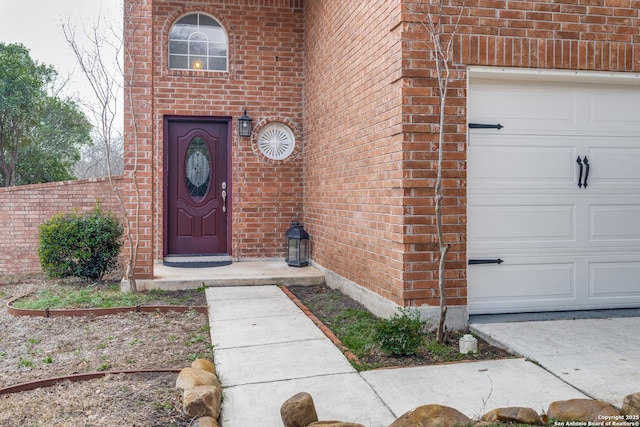 view of exterior entry featuring a garage