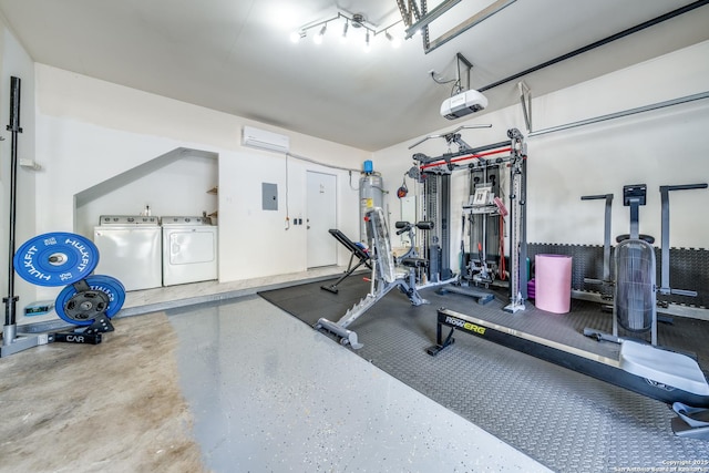 workout room with electric panel and washer and clothes dryer