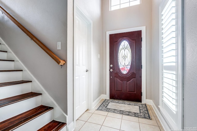 tiled entrance foyer with a wealth of natural light