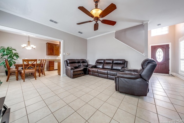 living room featuring crown molding, ceiling fan with notable chandelier, and light tile patterned floors