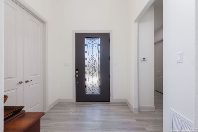 foyer entrance with light wood-type flooring