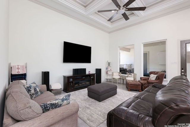 living room featuring crown molding, ceiling fan, beam ceiling, a high ceiling, and coffered ceiling