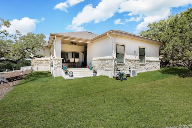 back of house with a lawn, cooling unit, ceiling fan, and a patio area