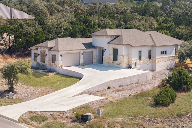 view of front facade with a garage and a front lawn