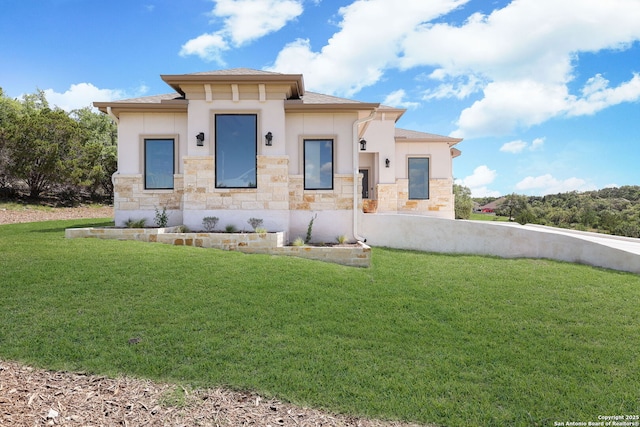 view of front of property with a front lawn