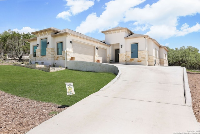 view of front of property featuring a garage and a front yard