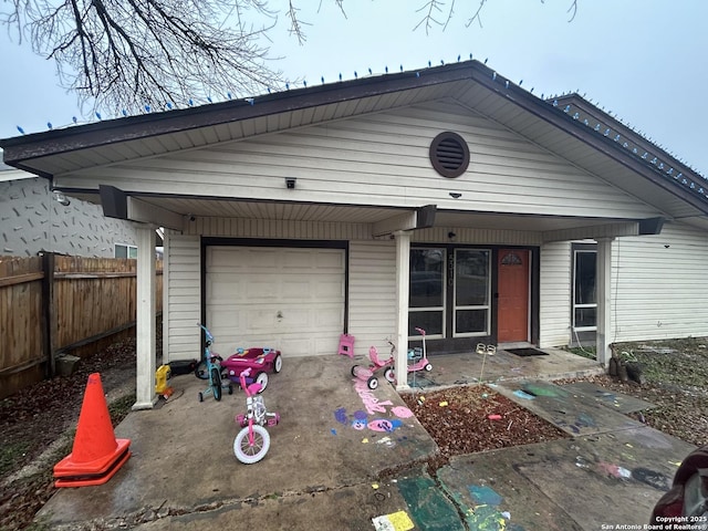 view of front of house featuring a garage and covered porch