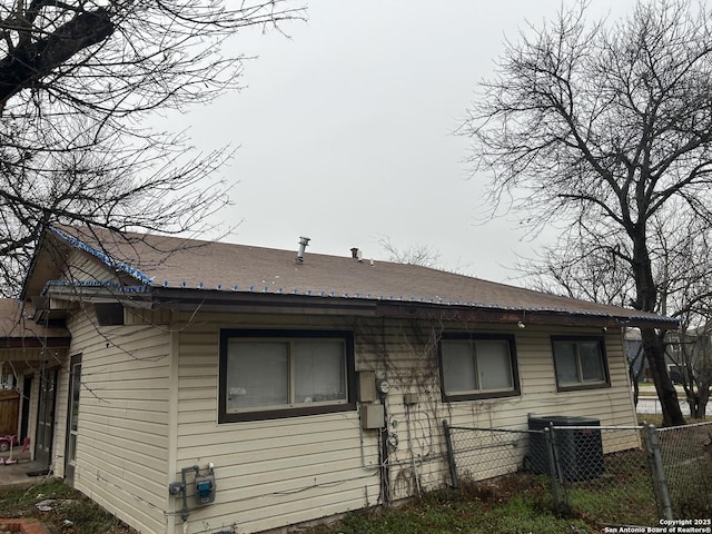 view of side of property featuring central AC unit