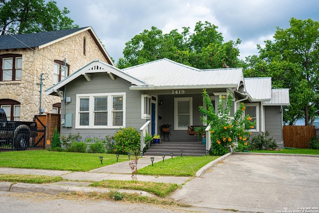 view of front of home with a front lawn and a porch