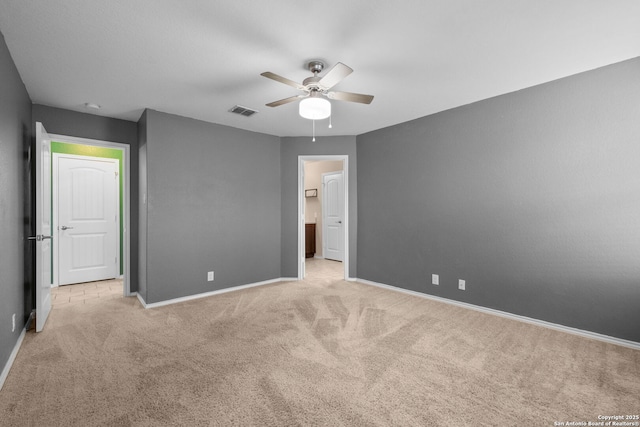 unfurnished bedroom featuring ceiling fan and light carpet