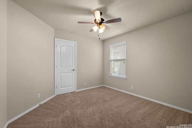 empty room with carpet flooring and ceiling fan