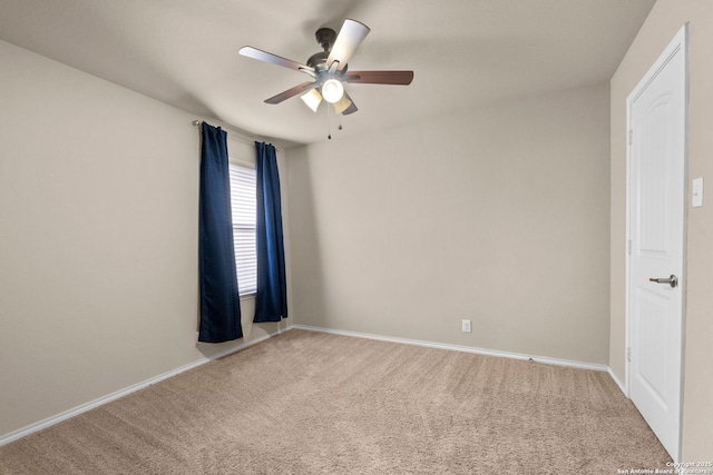 carpeted empty room with ceiling fan