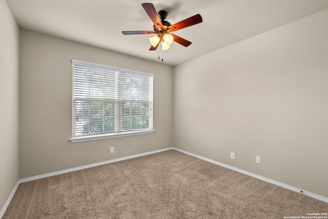 unfurnished room with carpet flooring and ceiling fan