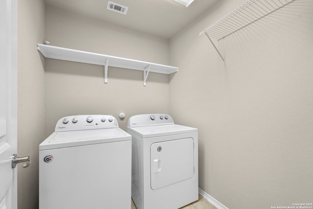 laundry area featuring separate washer and dryer