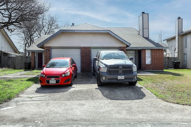 single story home with a garage and a front lawn