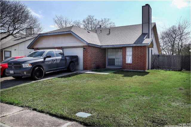 view of front of home with a garage and a front yard