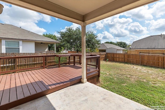 wooden deck with a yard