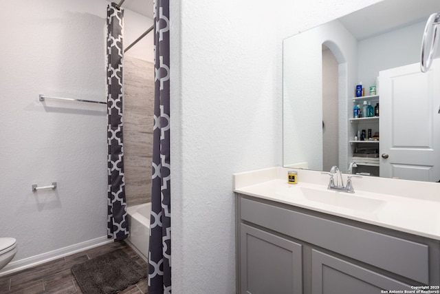 25046 Las Pilas, San Antonio, TX 78261 - full bathroom with shower / tub combo with curtain, vanity, toilet, and hardwood / wood-style floors