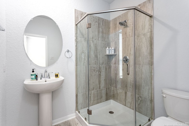 25046 Las Pilas, San Antonio, TX 78261 - bathroom with an enclosed shower, sink, and toilet