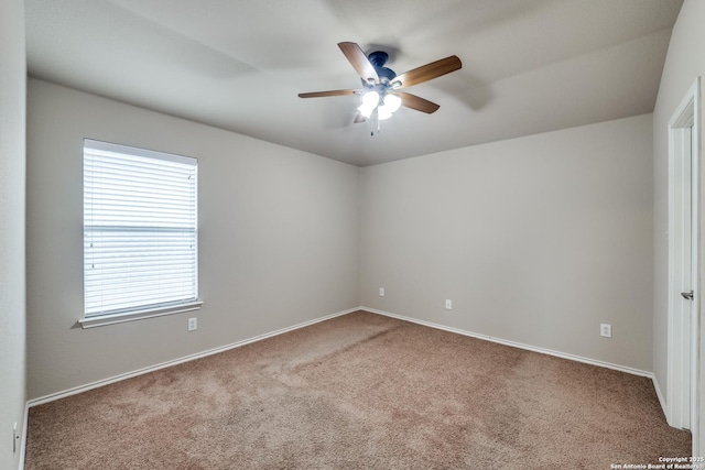 empty room with carpet and ceiling fan