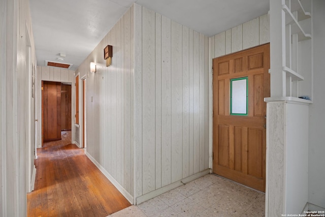 interior space featuring wooden walls