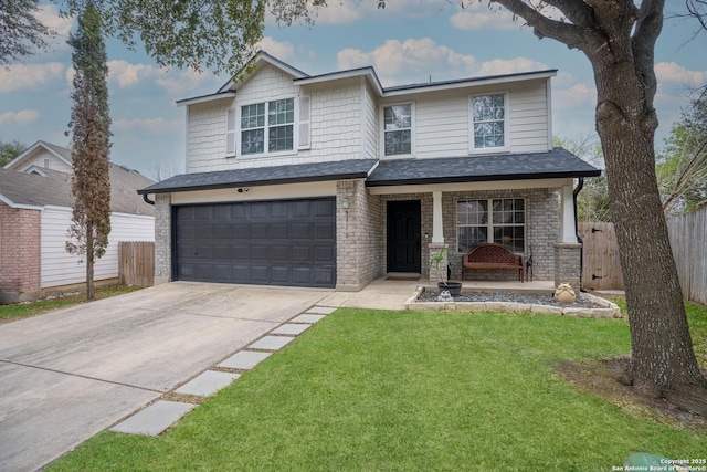 view of front of home with a garage, a porch, and a front yard