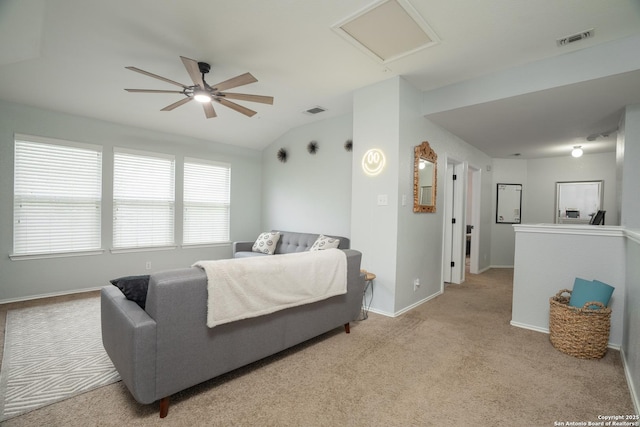 bedroom featuring light carpet, lofted ceiling, and ceiling fan