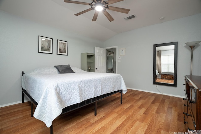 bedroom featuring vaulted ceiling, ceiling fan, and hardwood / wood-style floors