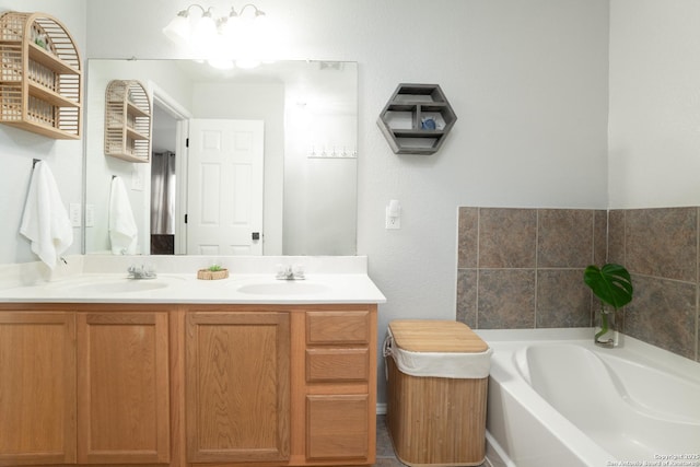 bathroom featuring vanity and a bath