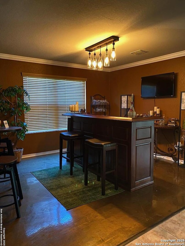 bar with crown molding and a textured ceiling