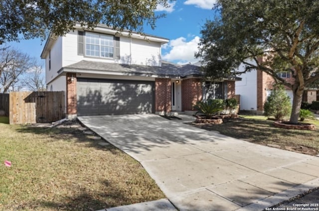 view of property featuring a garage and a front lawn