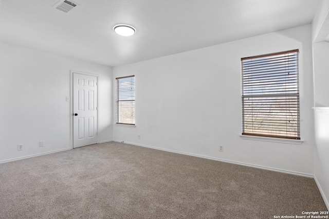 empty room with carpet flooring