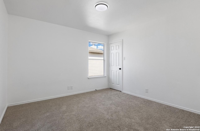 empty room featuring carpet floors