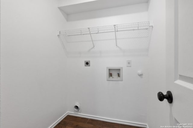 laundry area featuring hookup for a gas dryer, washer hookup, dark hardwood / wood-style floors, and hookup for an electric dryer