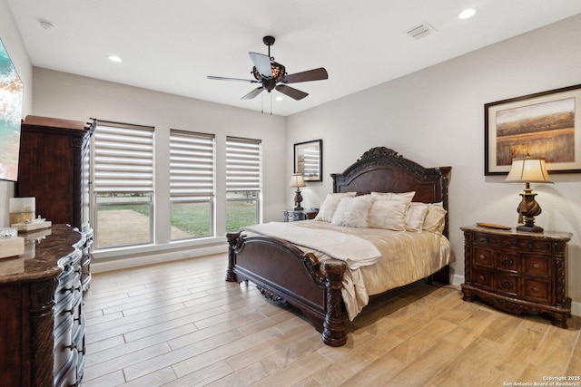 bedroom featuring ceiling fan and light wood-type flooring