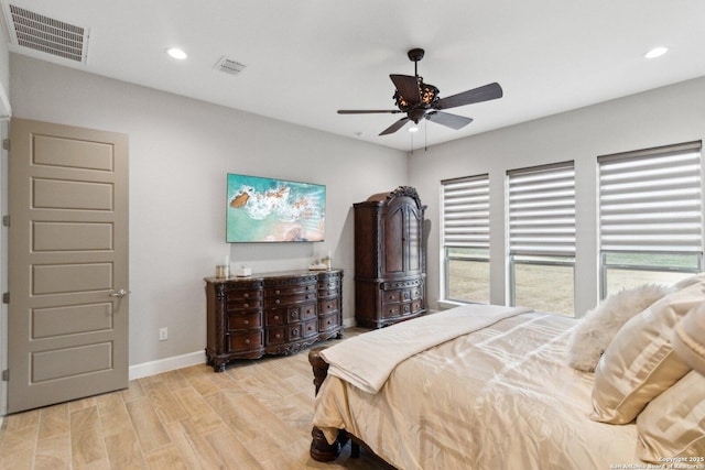 bedroom with ceiling fan and light wood-type flooring