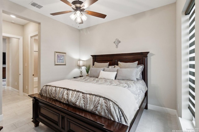 bedroom with ceiling fan and connected bathroom