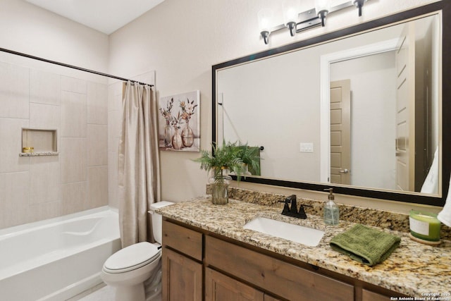 full bathroom with vanity, shower / bath combination with curtain, and toilet